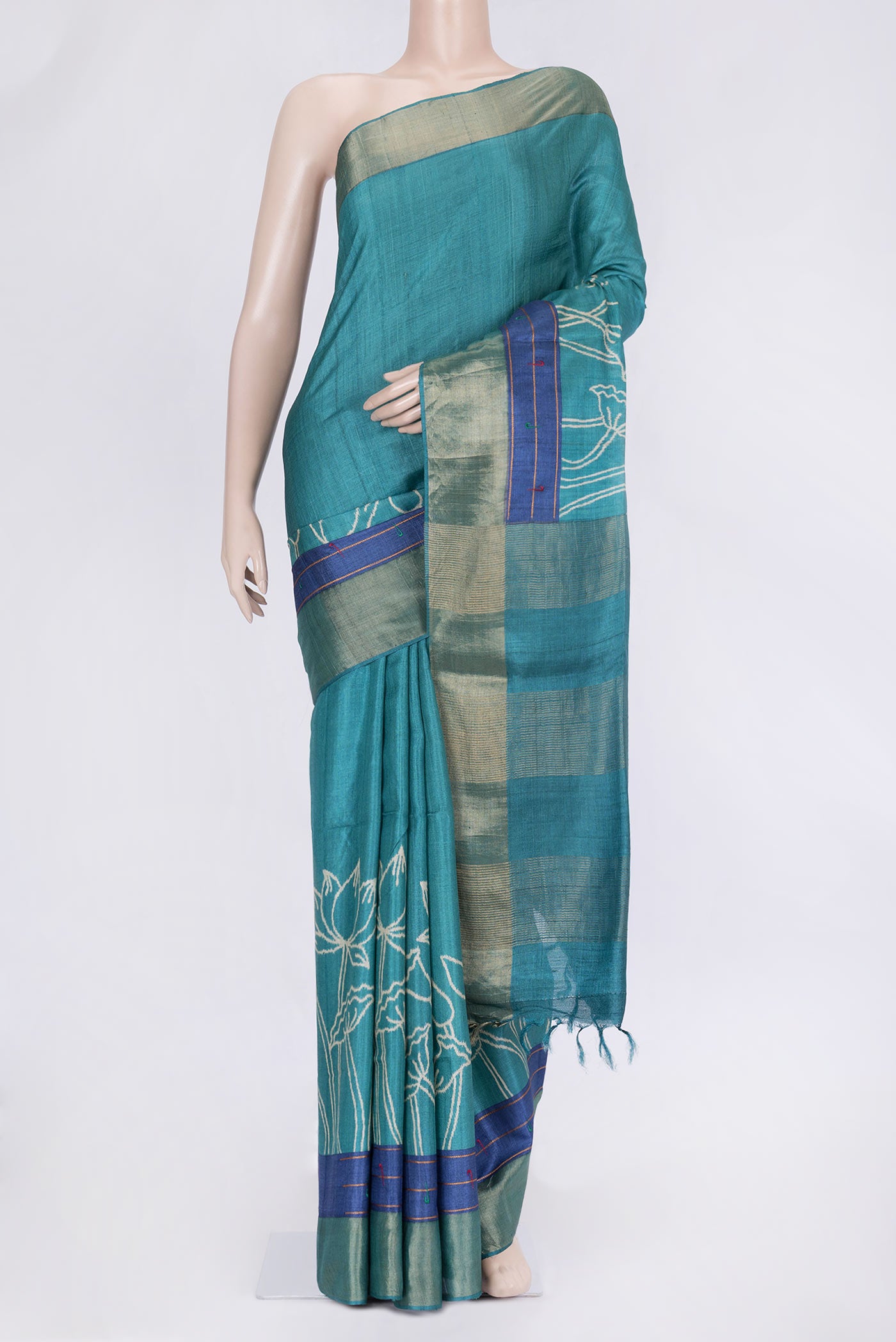 Sky Blue Dual Tone Tussar Silk Saree with Printed design on the body and Zari Border.  displayed on a mannequin