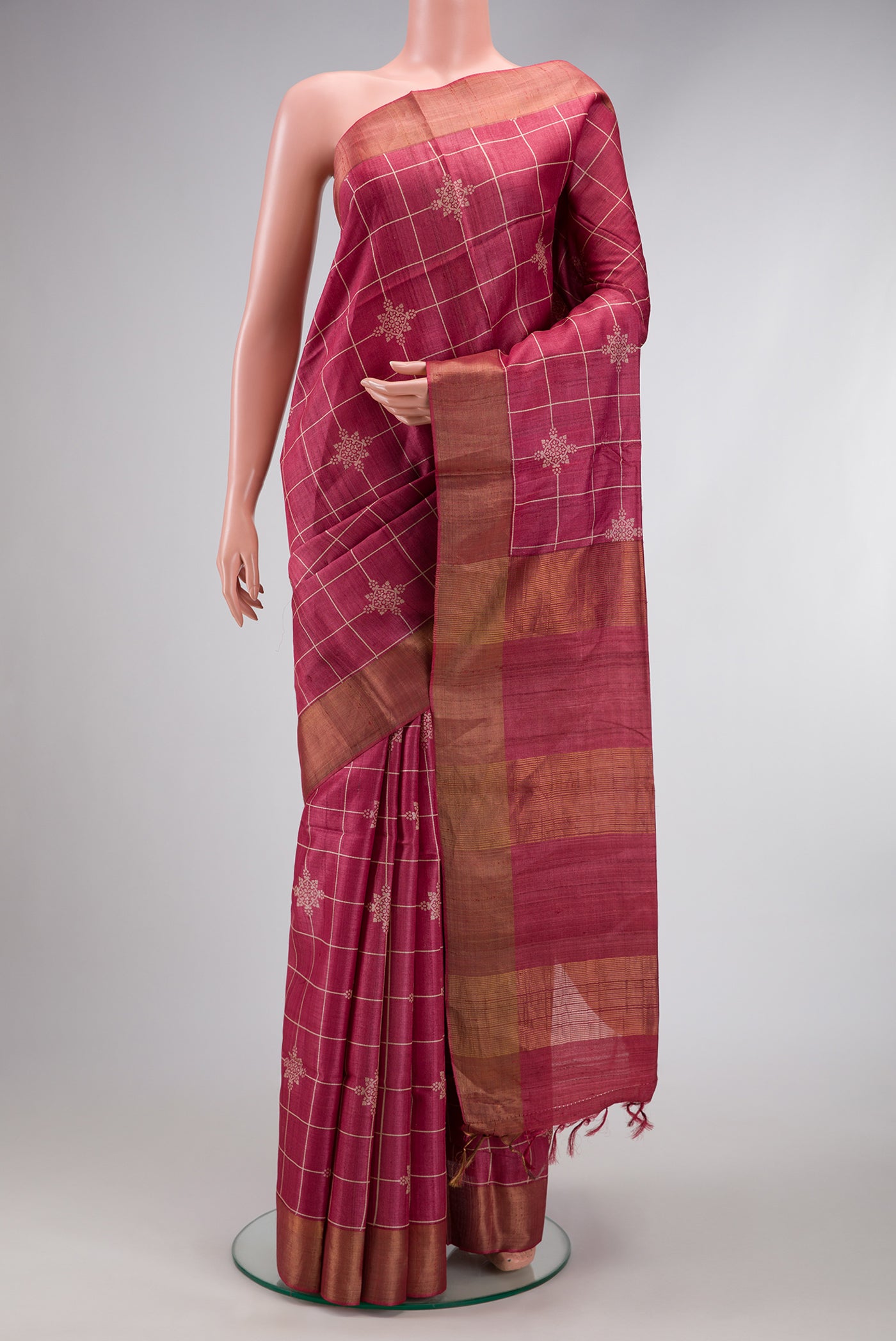 Pink Dual Tone Tussar Silk Saree with Checked design on the body and Zari Border.  displayed on a mannequin