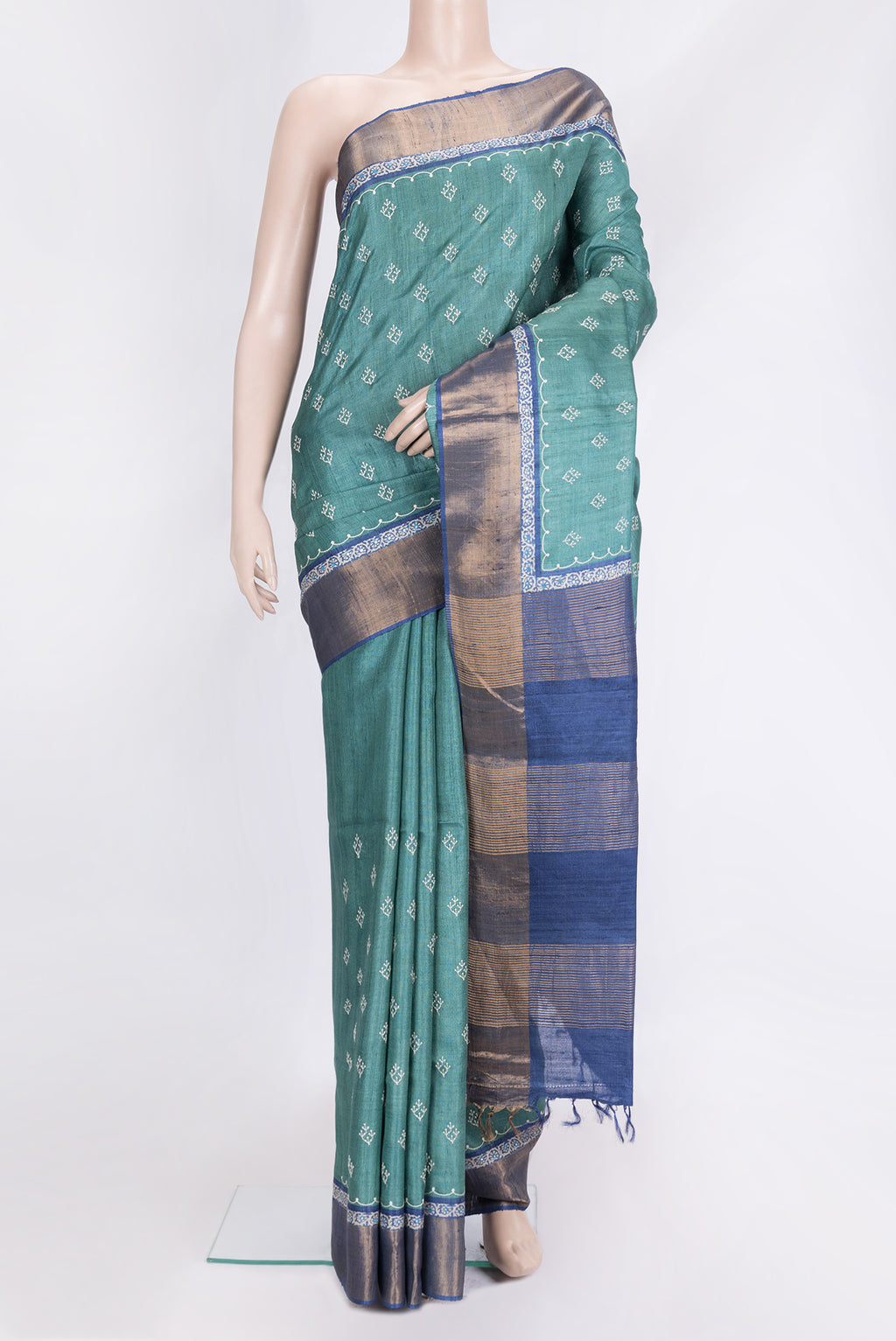 Green Dual Tone Tussar Silk Saree with Embroidery on the body and Zari Border.  displayed on a mannequin