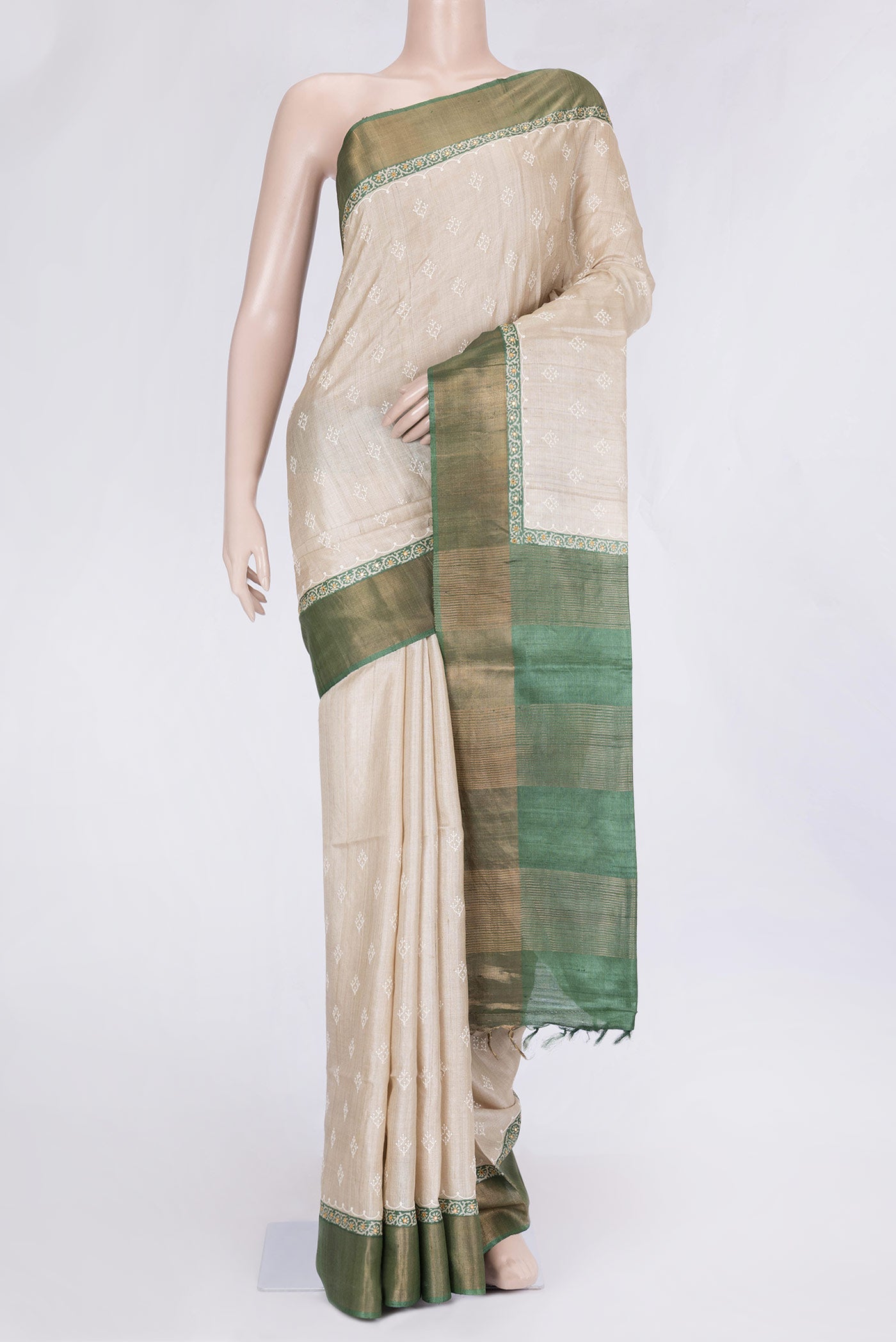 Beige Dual Tone Tussar Silk Saree with Embroidery on the body and Embroidery Border.  displayed on a mannequin