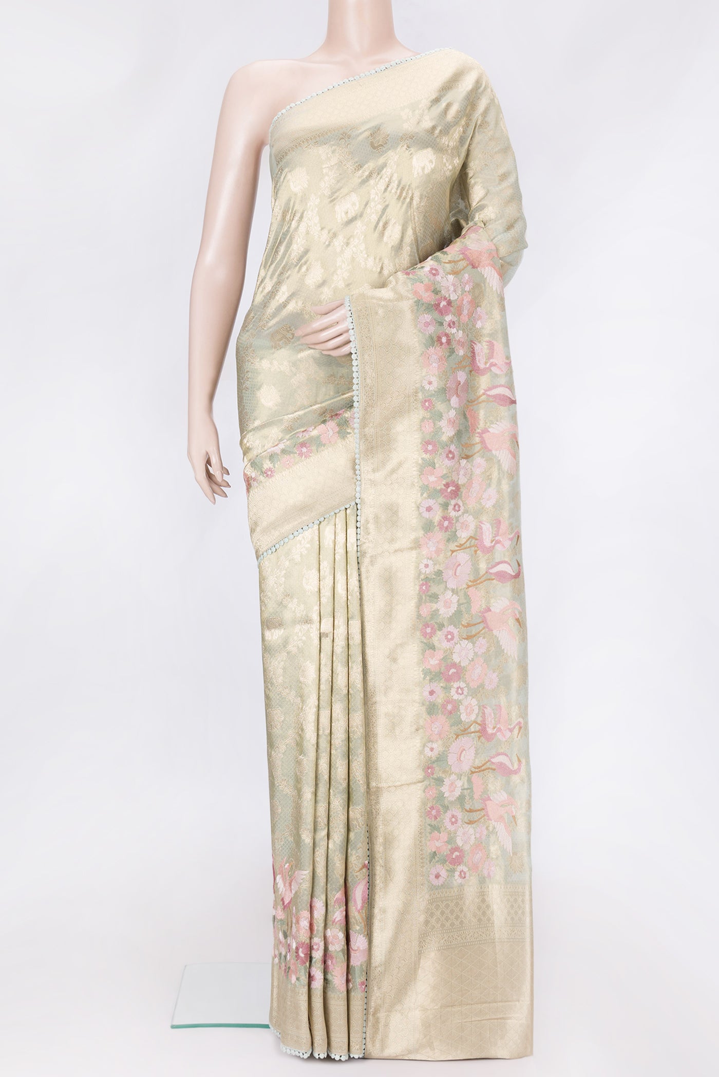 Pista Green Dual Tone Organza Silk Saree with Zari Brocade on the body and Embroidery Border.  displayed on a mannequin