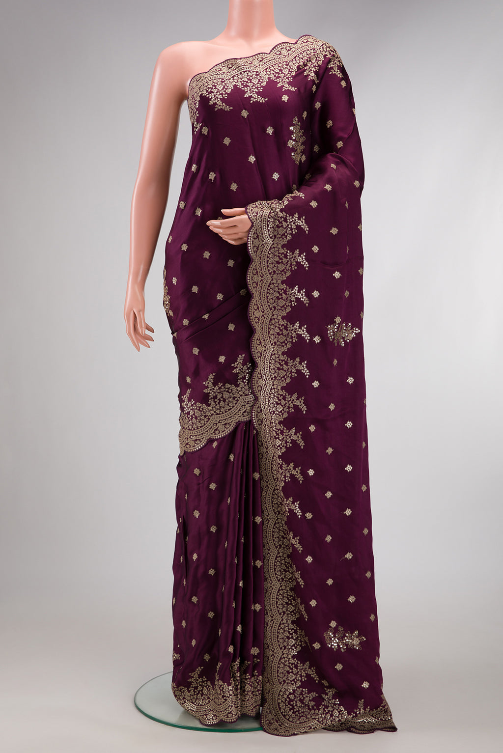 Burgundy Dual Tone Mysore Crepe Saree with Embroidery on the body and Embroidery Border.  displayed on a mannequin