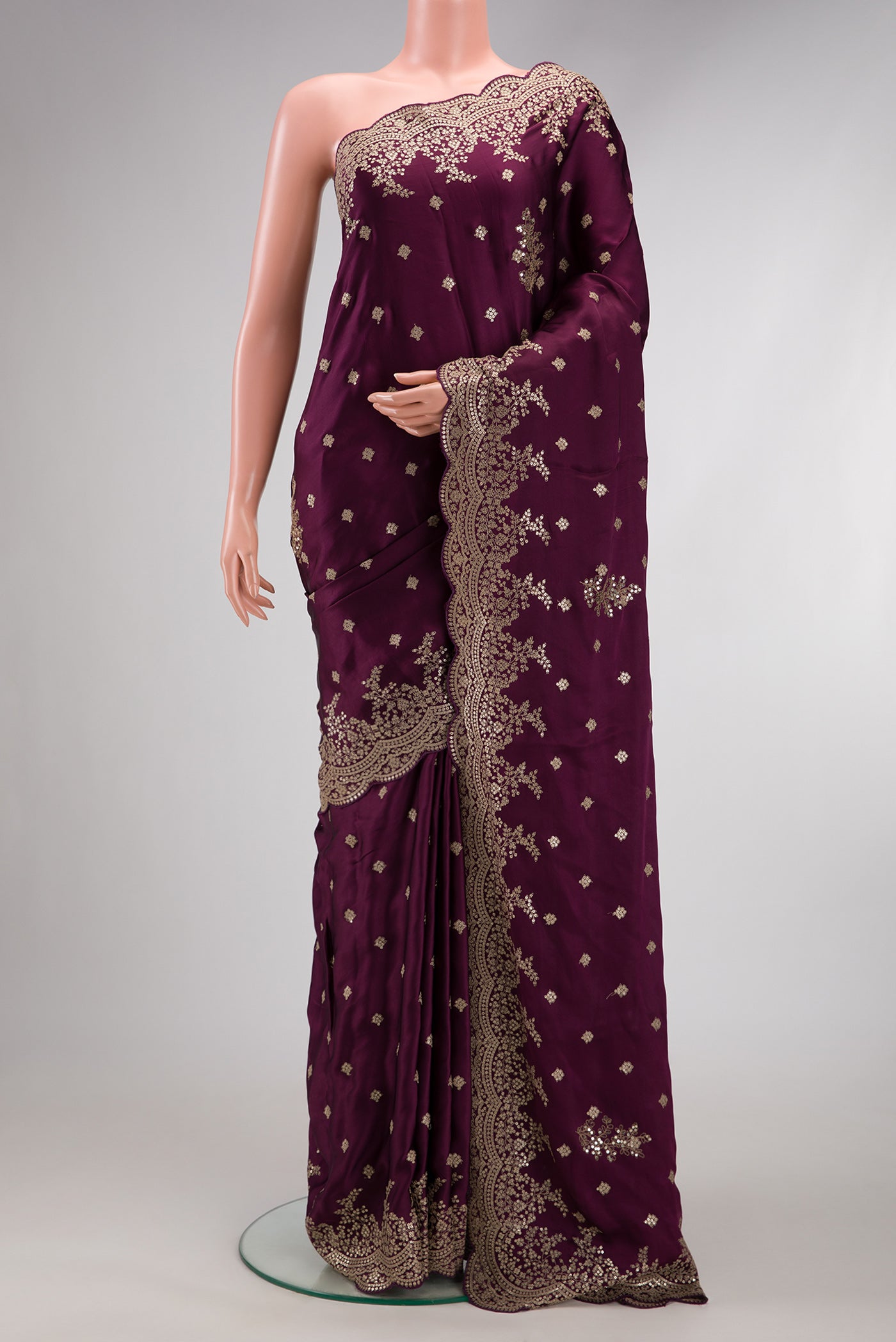 Burgundy Dual Tone Mysore Crepe Saree with Embroidery on the body and Embroidery Border.  displayed on a mannequin