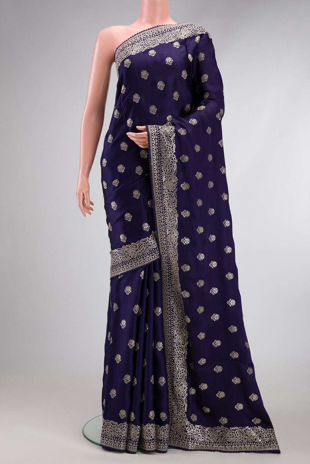 Navy Blue Dual Tone Crepe Saree with Embroidery on the body and Embroidery Border.  displayed on a mannequin