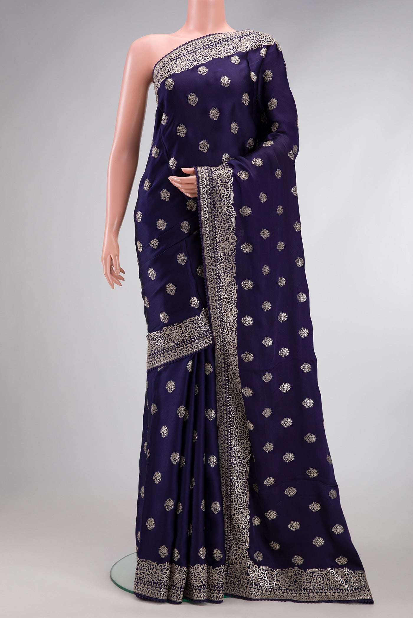 Navy Blue Dual Tone Crepe Saree with Embroidery on the body and Embroidery Border.  displayed on a mannequin