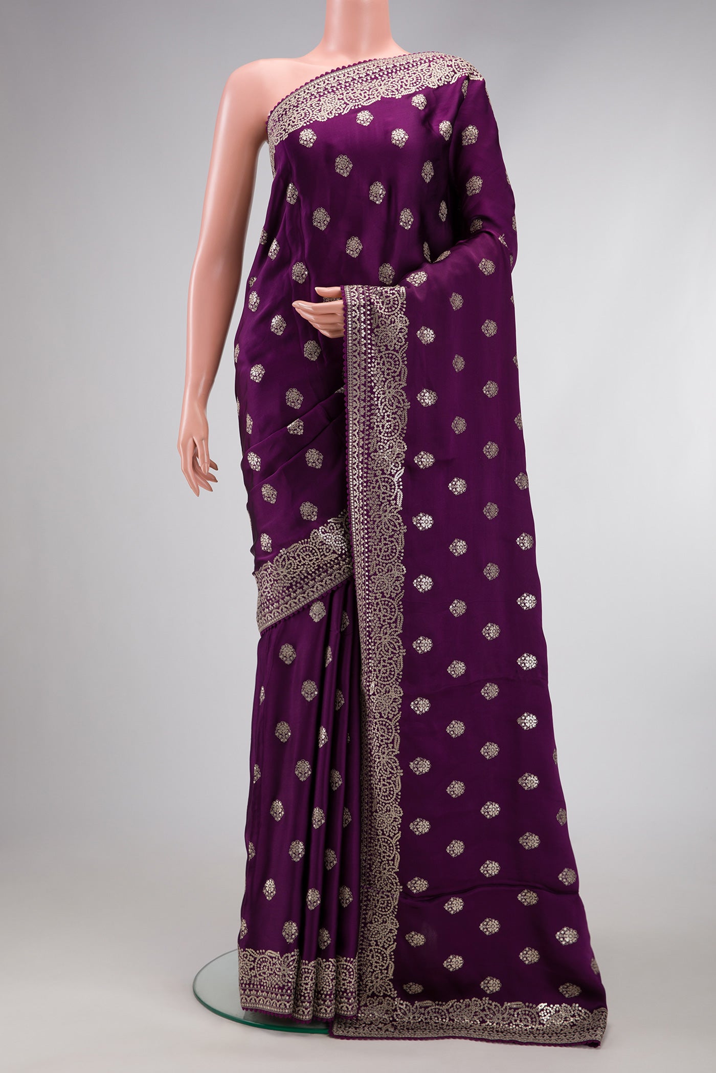 Purple Dual Tone Crepe Saree with Embroidery on the body and Embroidery Border.  displayed on a mannequin