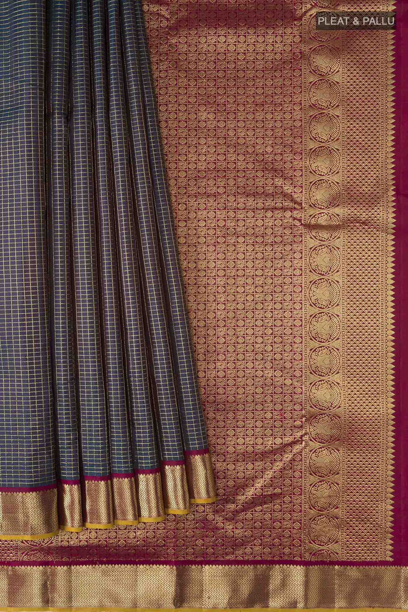 Pleats and pallu of Blue Kanchipuram Silk Saree with Checked design on the body and Zari Border