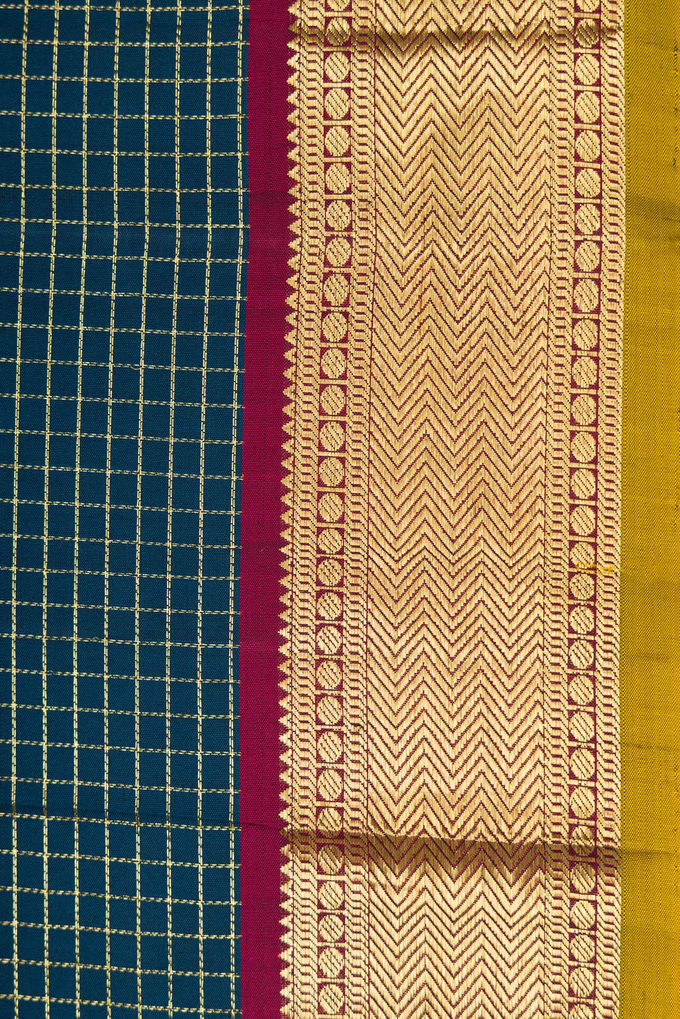 Border image of Peacock Blue Dual Tone Kanchipuram Silk Saree with Checked design on the body and Zari Border. 