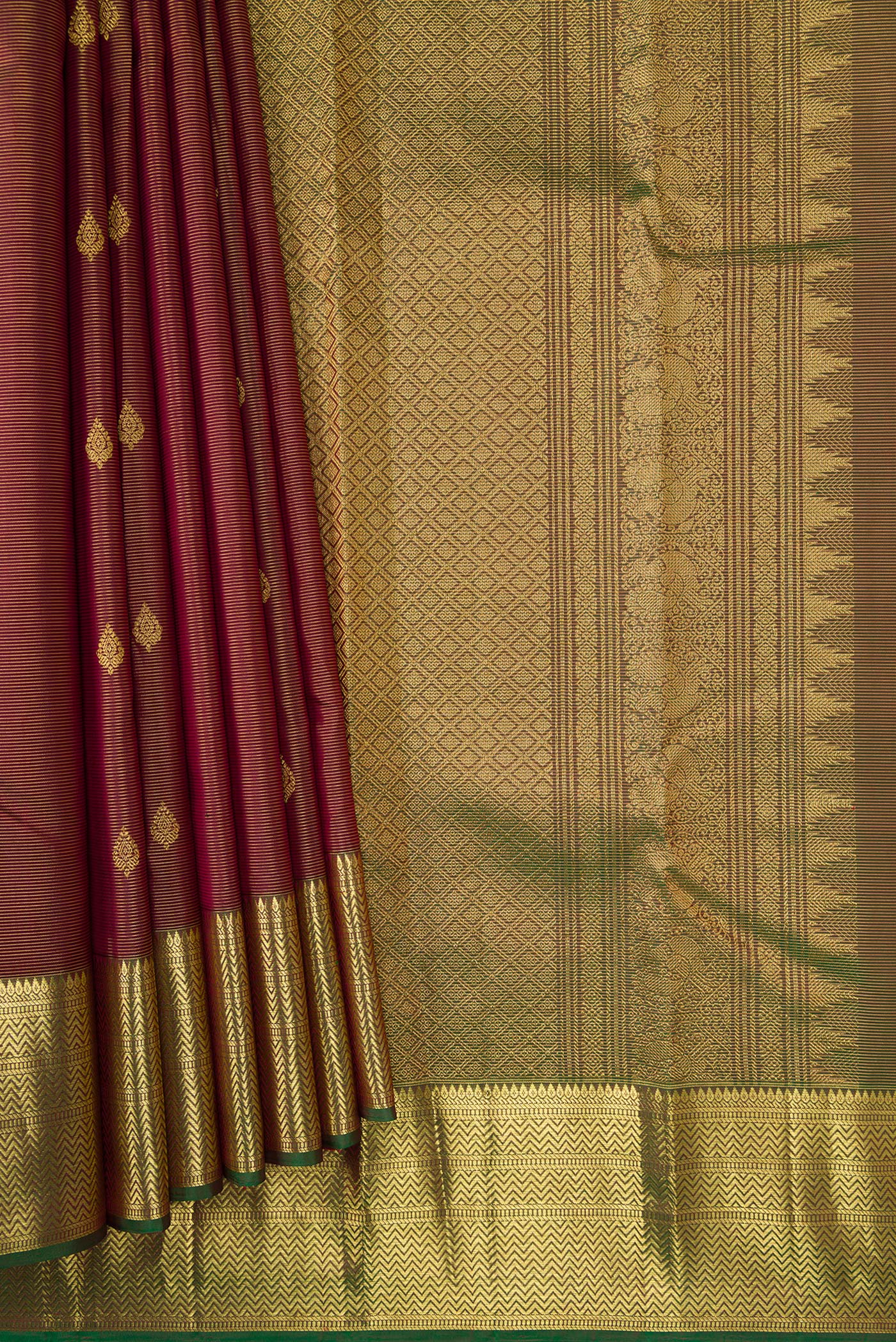 Pleats and pallu of Brown Dual Tone Kanchipuram Silk Saree with Zari Butta on the body and Zari Border. 
