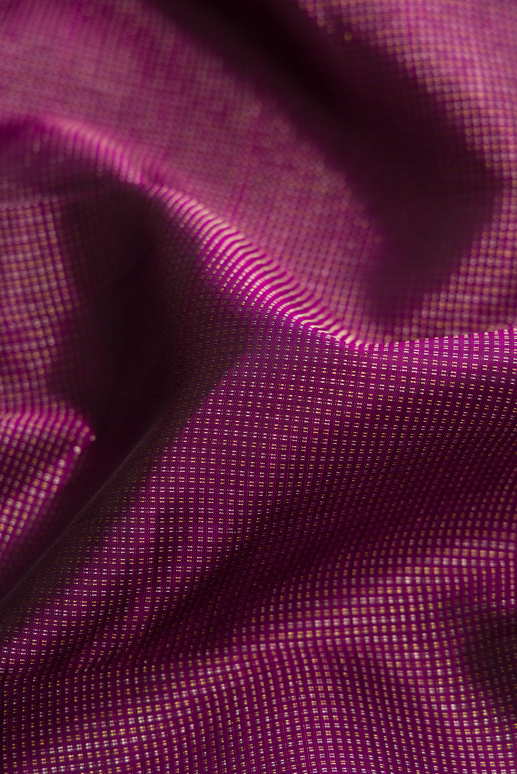 Close up of Burgundy Dual Tone Kanchipuram Silk Saree with Stripes on the body and Fancy Border.  displaying folds