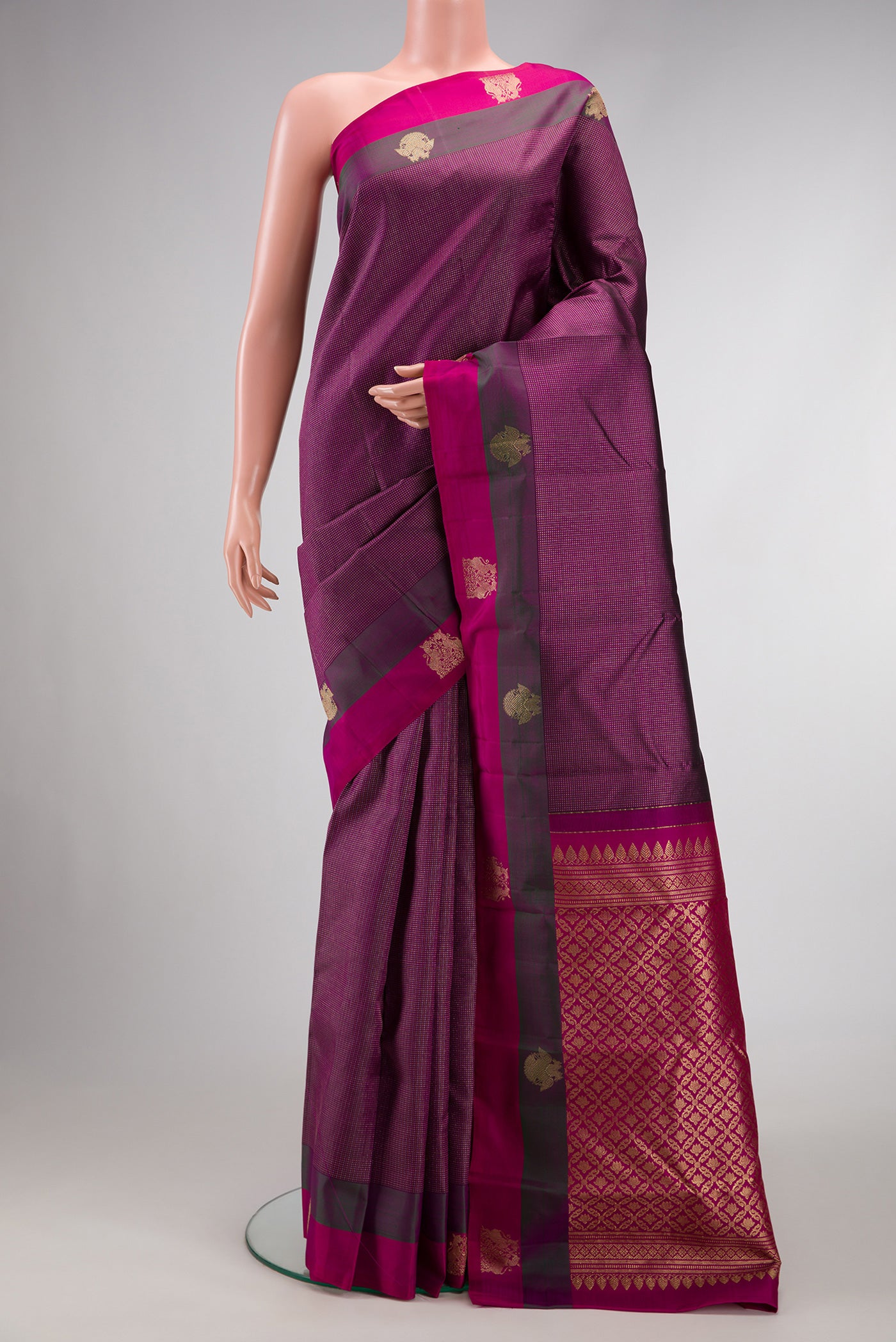 Burgundy Dual Tone Kanchipuram Silk Saree with Stripes on the body and Fancy Border.  displayed on a mannequin