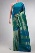 Peacock Blue Dual Tone Kanjivaram Silk Saree with Plain Body and Rising Temple Border.  displayed on a mannequin