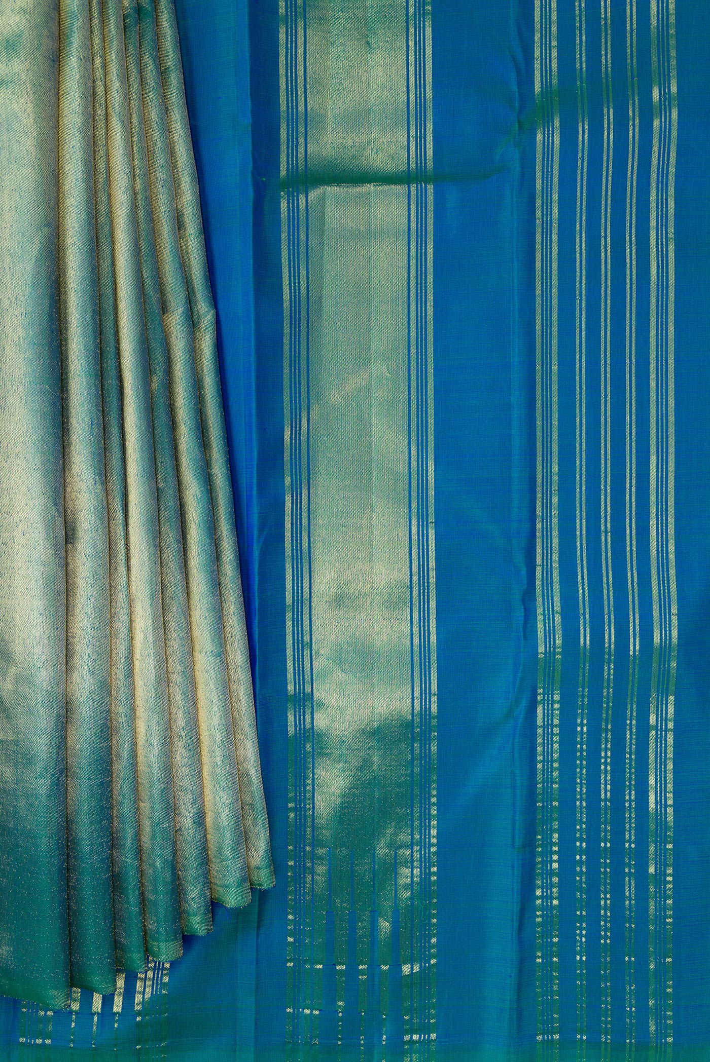 Pleats and pallu of Peacock Blue Dual Tone Kanjivaram Silk Saree with Plain Body and Rising Temple Border. 