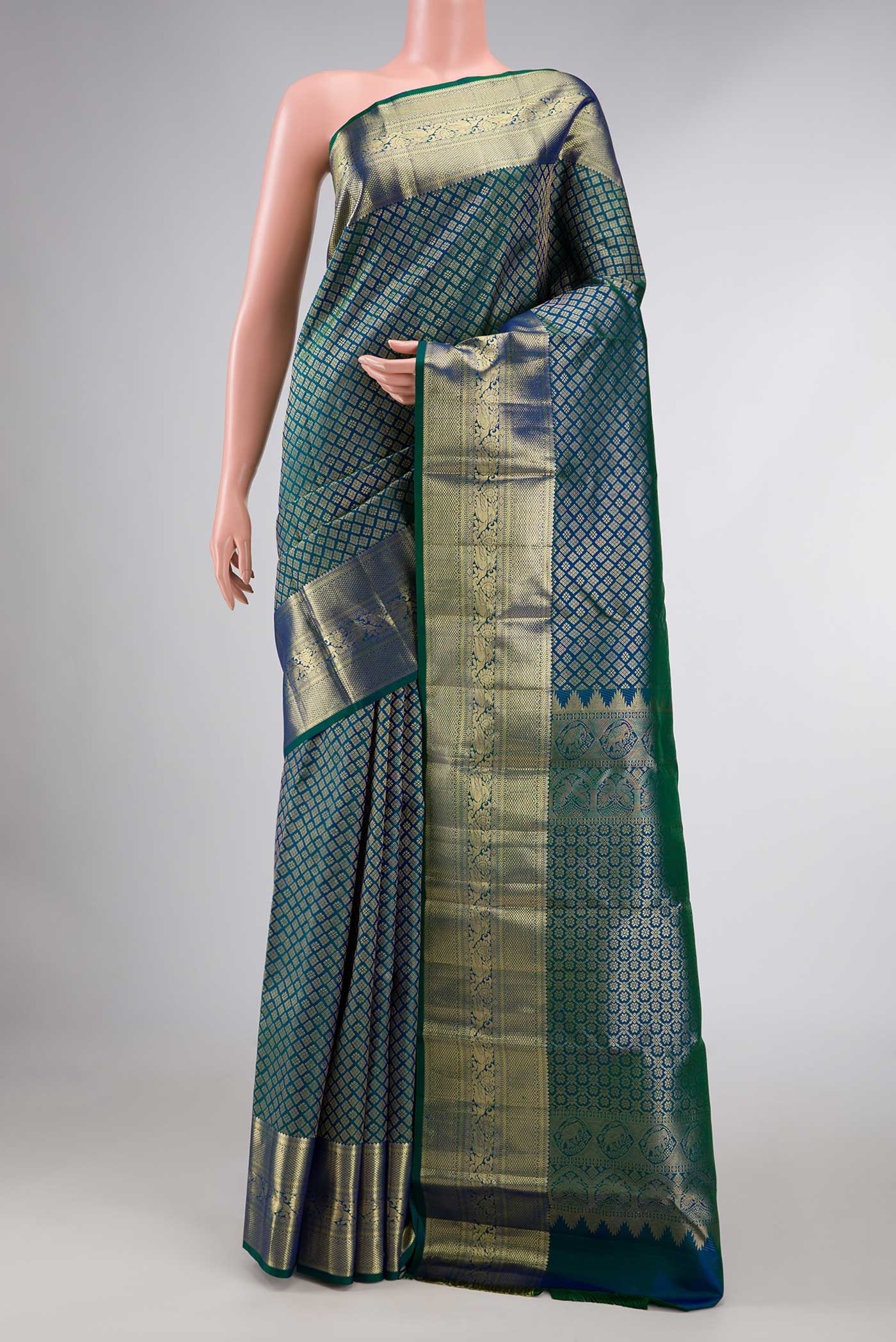 Peacock Blue Dual Tone Kanchipuram Silk Saree with Zari Brocade on the body and Zari Border displayed on a mannequin