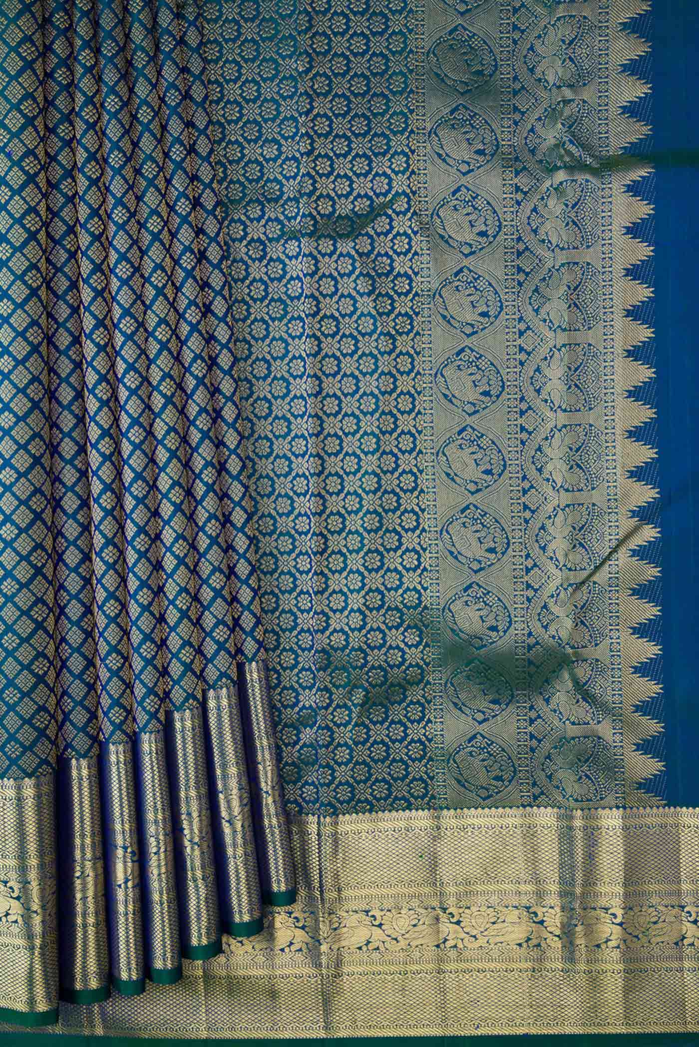 Pleats and pallu of Peacock Blue Dual Tone Kanchipuram Silk Saree with Zari Brocade on the body and Zari Border