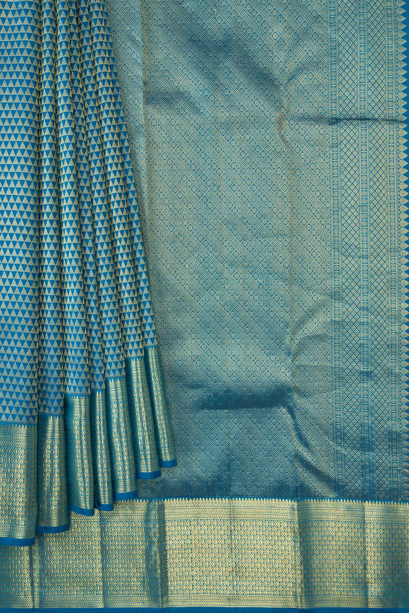 Pleats and pallu of Peacock Blue Dual Tone Kanjivaram Silk Saree with Zari Brocade on the body and Zari Border. 