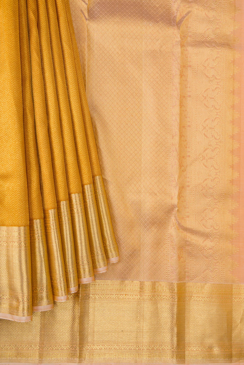 Pleats and pallu of Gold Dual Tone Kanjivaram Silk Saree with Zari Brocade on the body and Zari Border. 