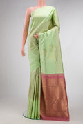 Pure Silk Pure Zari Pista Green Dual Tone Kanchipuram Saree with Jacquard design on the body and Fancy Border.  displayed on a mannequin