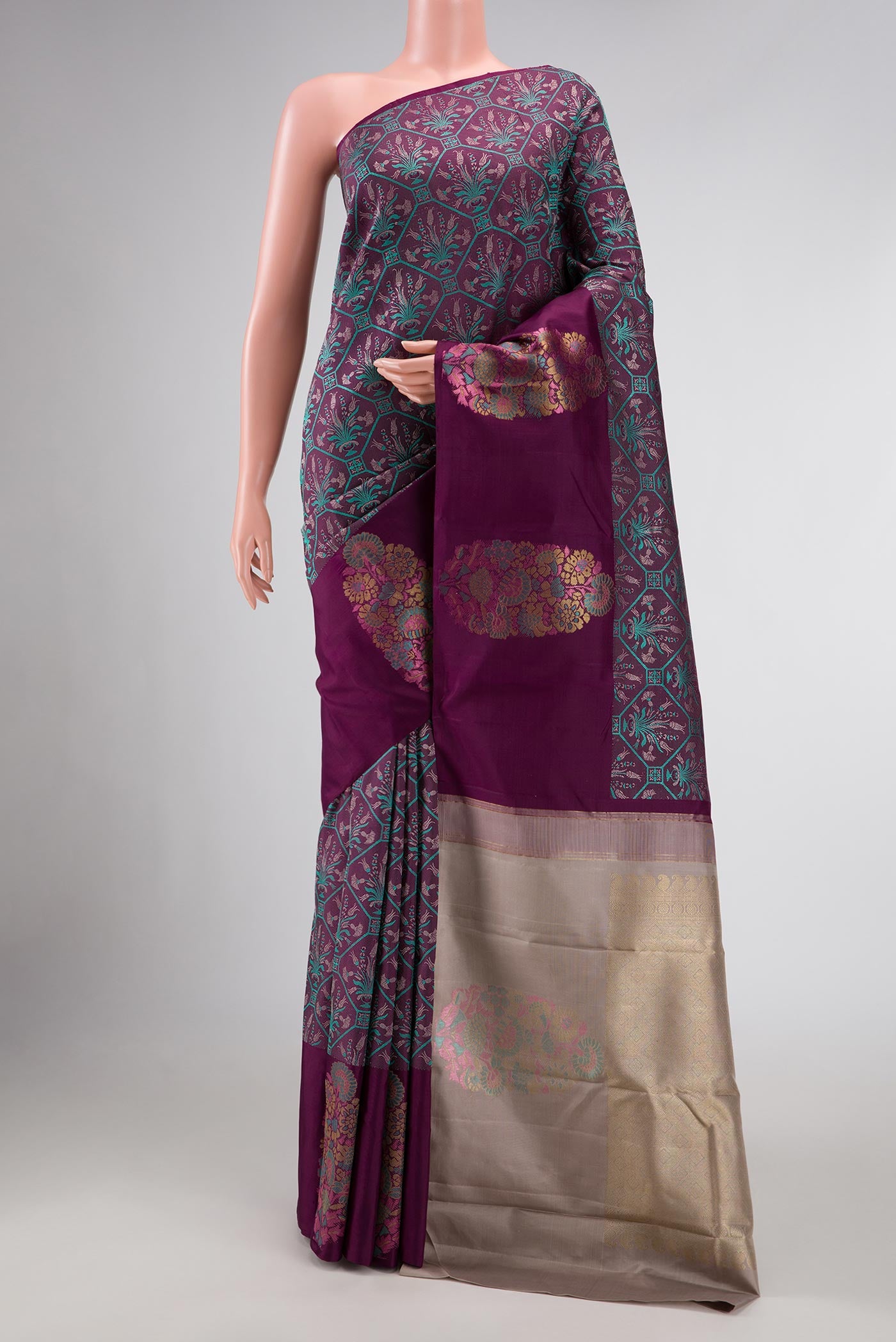 Burgundy Dual Tone Kanchipuram Silk Saree with Jacquard design on the body and Fancy Border displayed on a mannequin