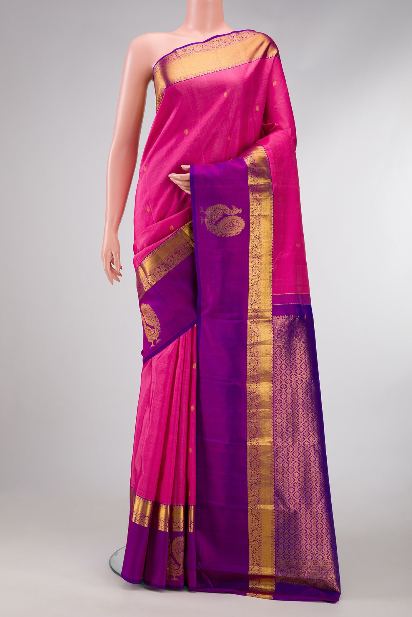 Pink Dual Tone Kanchipuram Silk Saree with Zari Butta on the body and Fancy Border.  displayed on a mannequin