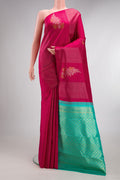 Pure Silk Dark Pink Dual Tone Kanjivaram Saree with Zari Butta on the body and Without Border.  displayed on a mannequin
