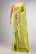 Green Dual Tone Kanchipuram Silk Saree with Zari Butta on the body and Zari Border displayed on a mannequin