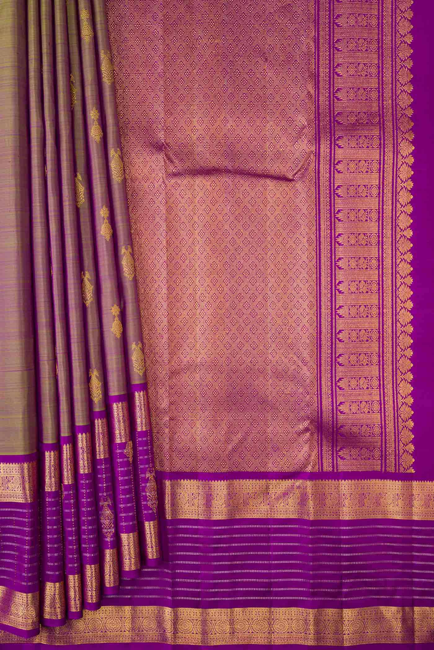 Pleats and pallu of Green with Purple Color Kanchipuram Silk Saree with Zari Butta on the body and Zari Border