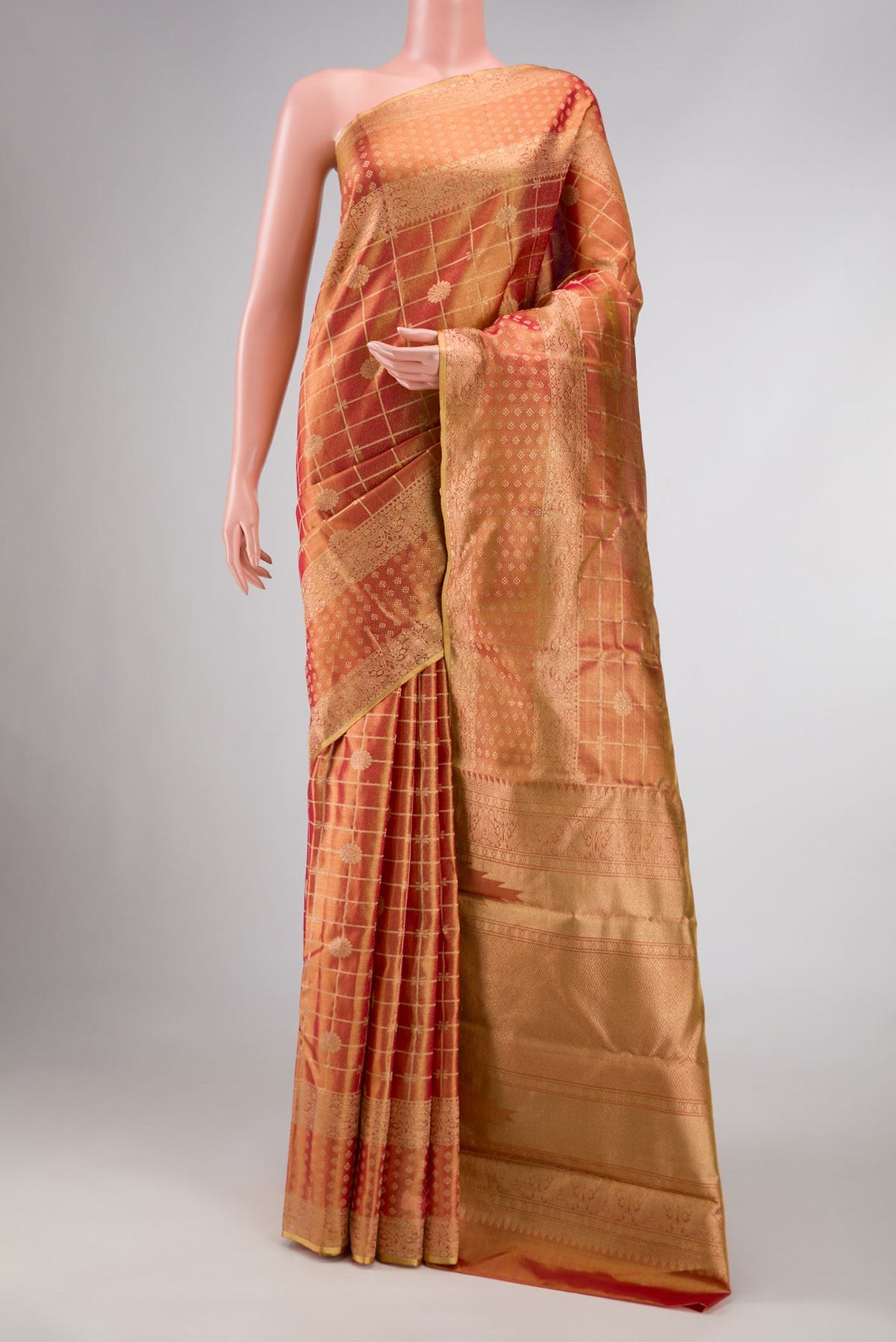 Dark Pink Dual Tone Kanchipuram Tissue Silk Saree with Zari Brocade on the body and Zari Border displayed on a mannequin