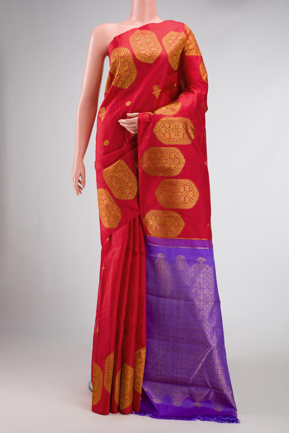 Red Dual Tone Kanjivaram Silk Saree with Zari Butta on the body and Fancy Border.  displayed on a mannequin