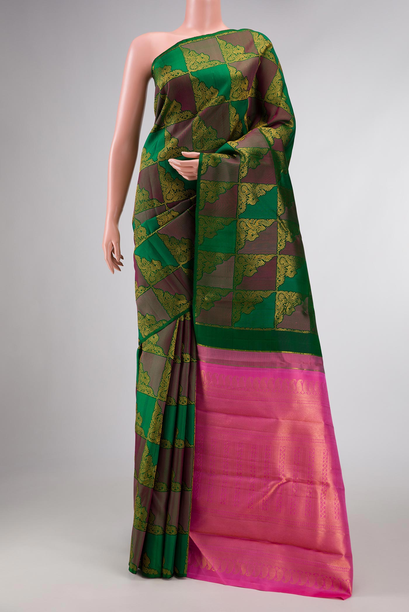 Bottle Green Dual Tone Kanchipuram Silk Saree with Zari Brocade on the body and Without Border displayed on a mannequin