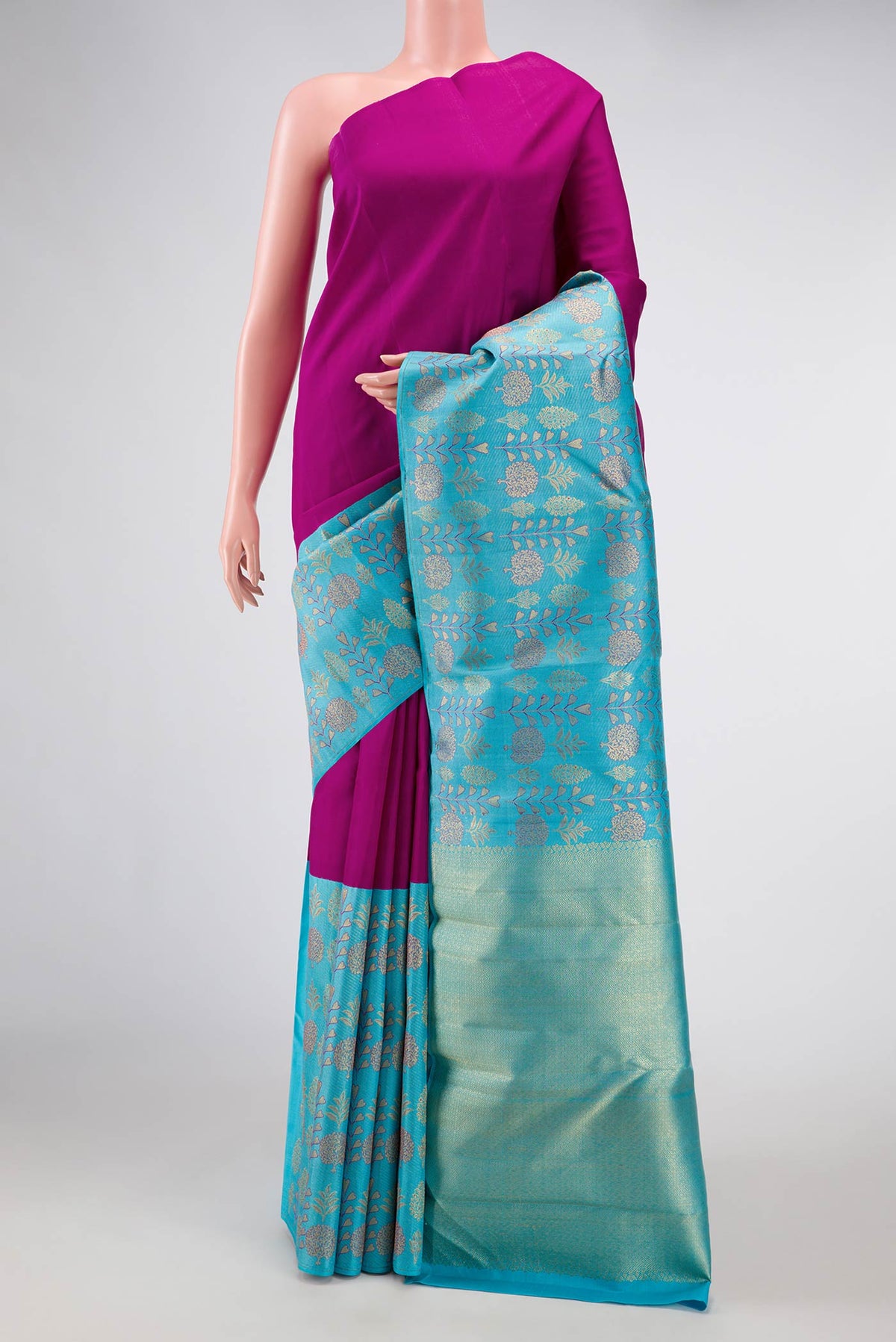 Magenta Dual Tone Kanchipuram Silk Saree with Plain Body and Fancy Border displayed on a mannequin
