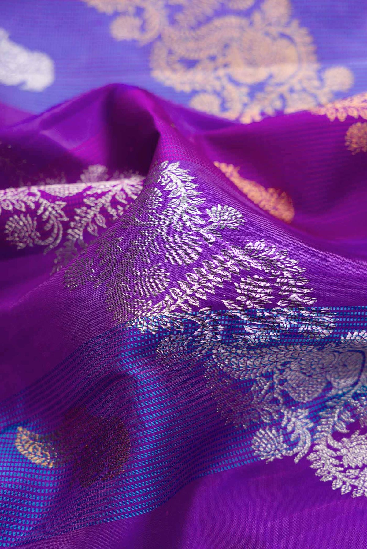 Close up of Royal Blue Dual Tone Kanchipuram Silk Saree with Zari Brocade on the body and Zari Border displaying folds