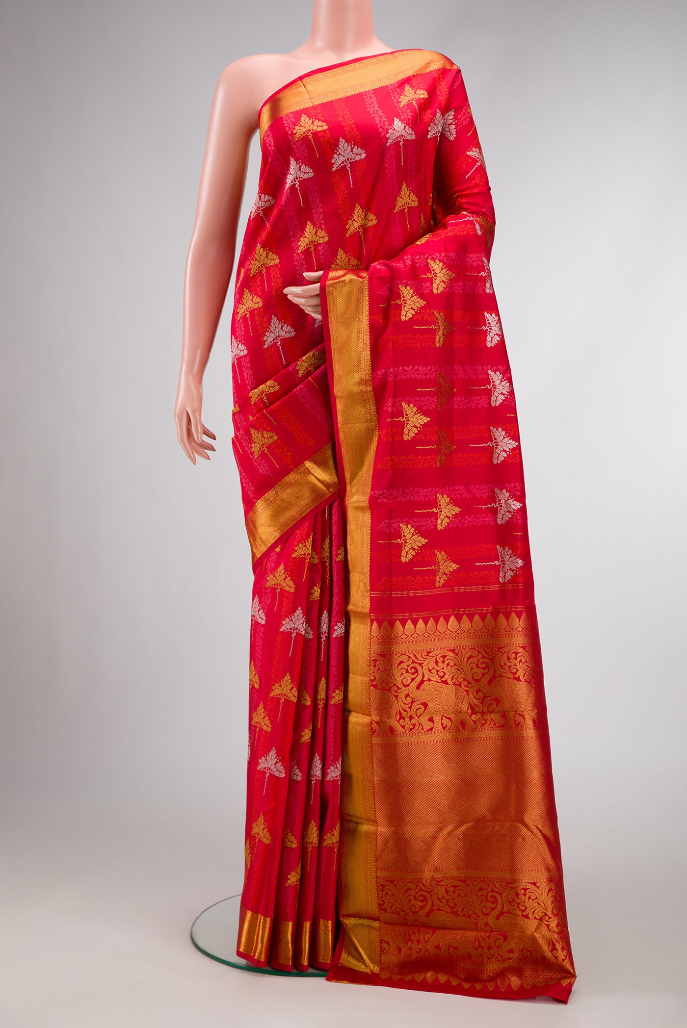 Pure Silk Pure Zari Red Dual Tone Kanchipuram Saree with Jacquard With Zari Butta on the body and Zari Border.  displayed on a mannequin