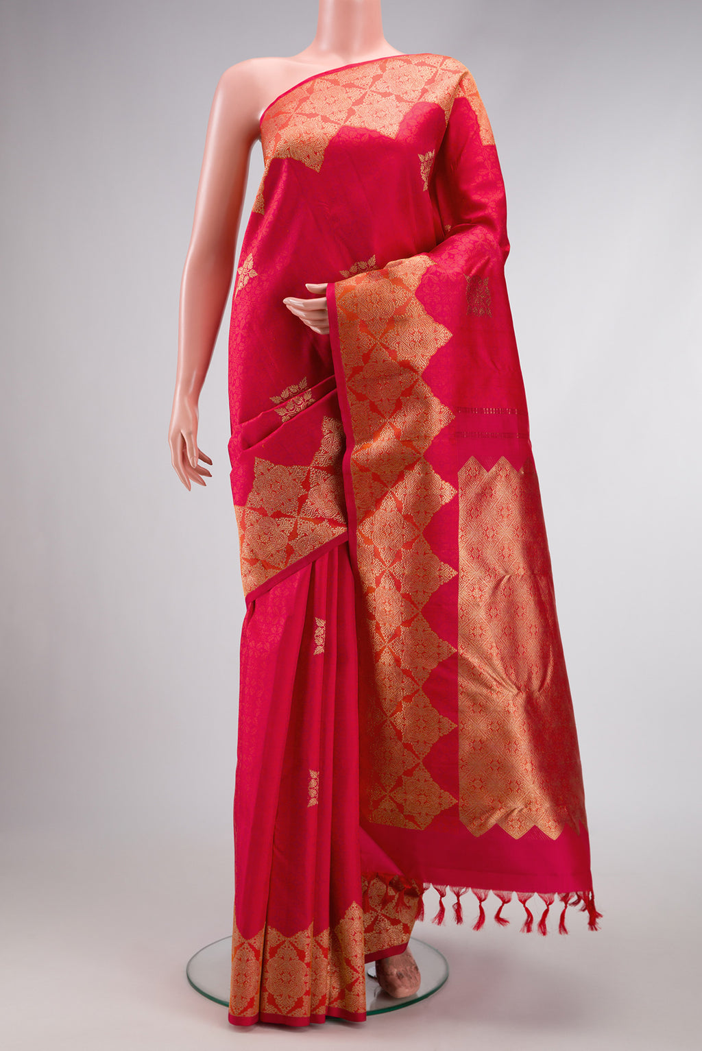Red Dual Tone Kanjivaram Silk Saree with Zari Butta on the body and Fancy Border.  displayed on a mannequin