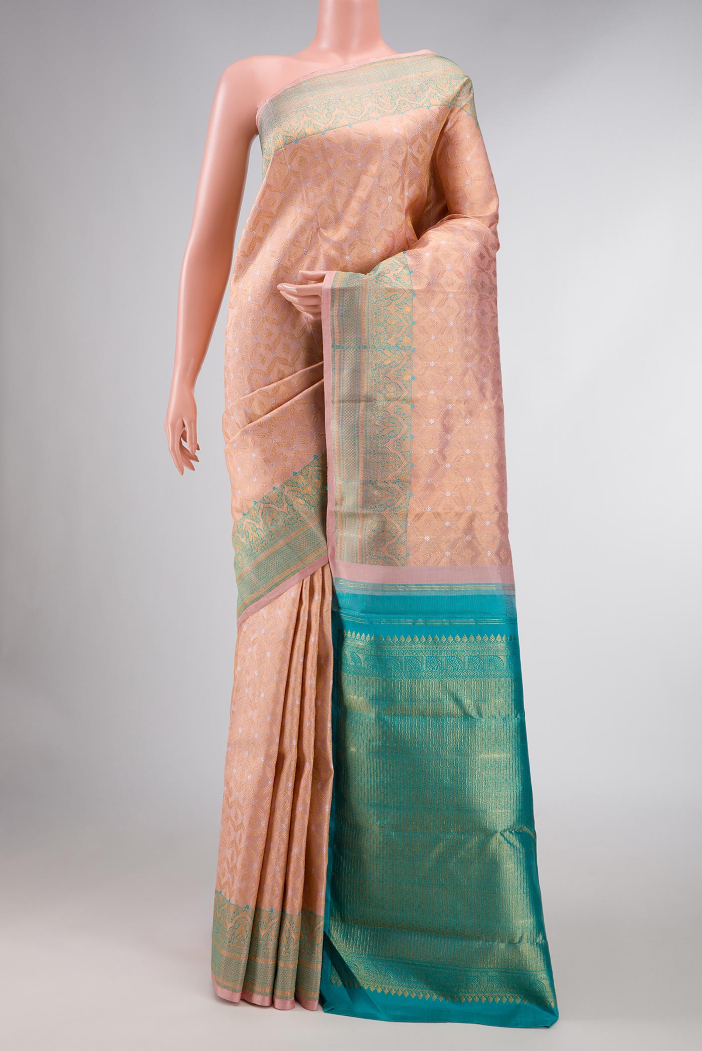 Rose Gold Dual Tone Kanchipuram Silk Saree with Zari Brocade on the body and Zari Border displayed on a mannequin