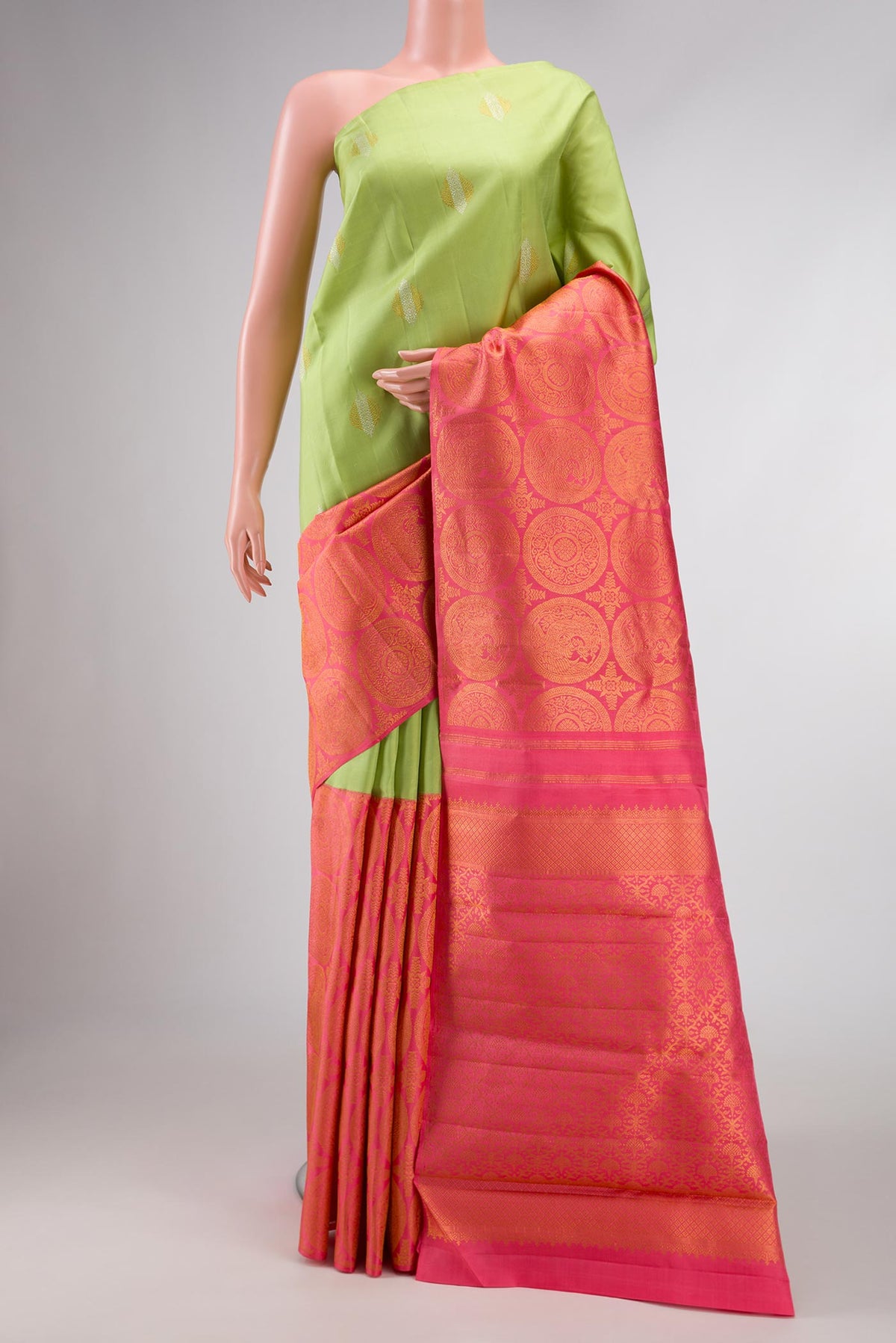 Pista Green and pink Color Kanchipuram Silk Saree with Half And Half on the body and Without Border displayed on a mannequin
