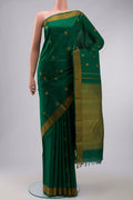 Green Kanchipuram Silk Saree with Thread Butta on the body and Thread Border displayed on a mannequin