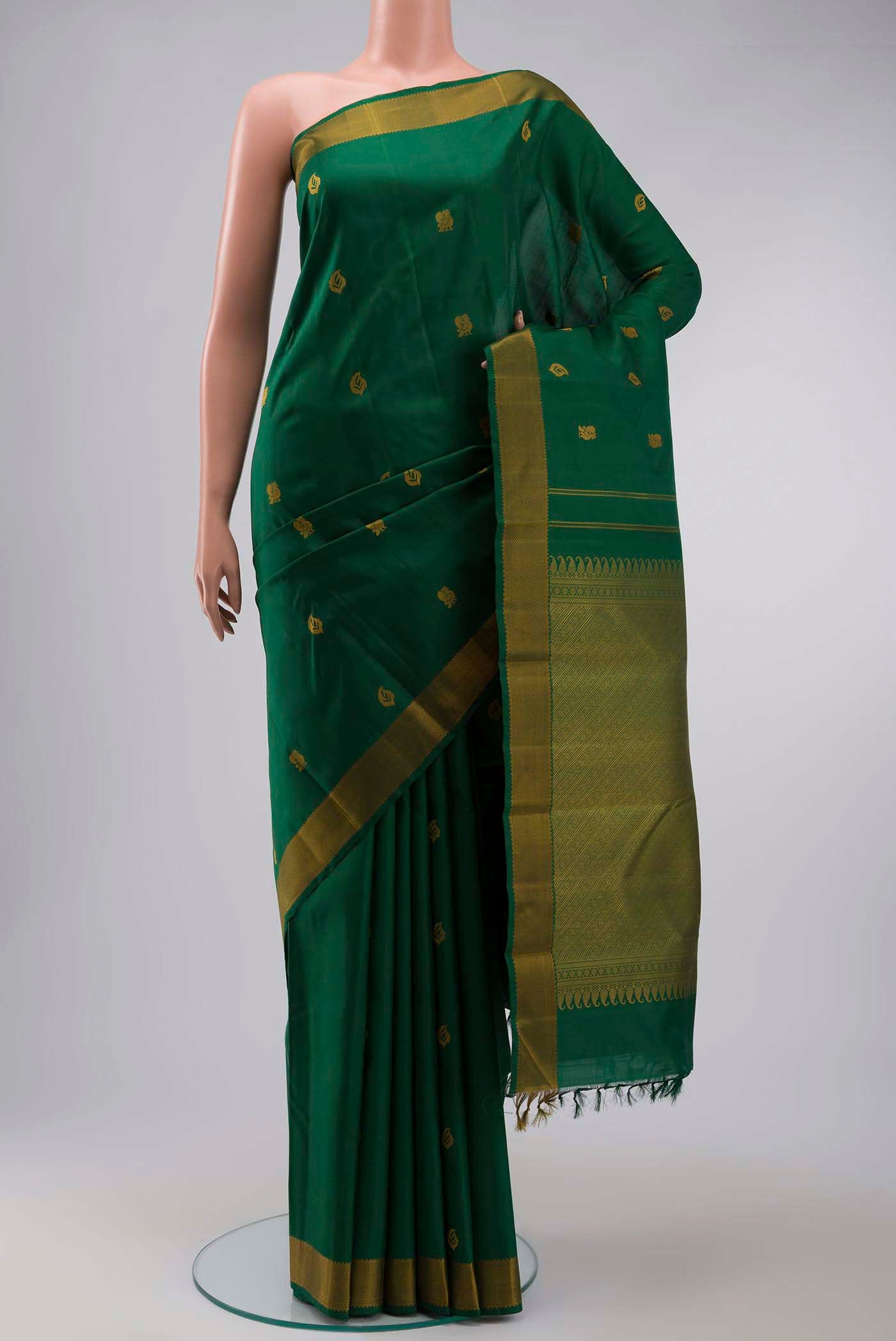 Green Kanchipuram Silk Saree with Thread Butta on the body and Thread Border displayed on a mannequin