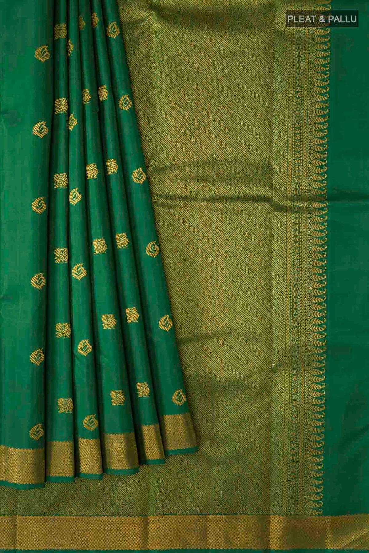 Pleats and pallu of Green Kanchipuram Silk Saree with Thread Butta on the body and Thread Border