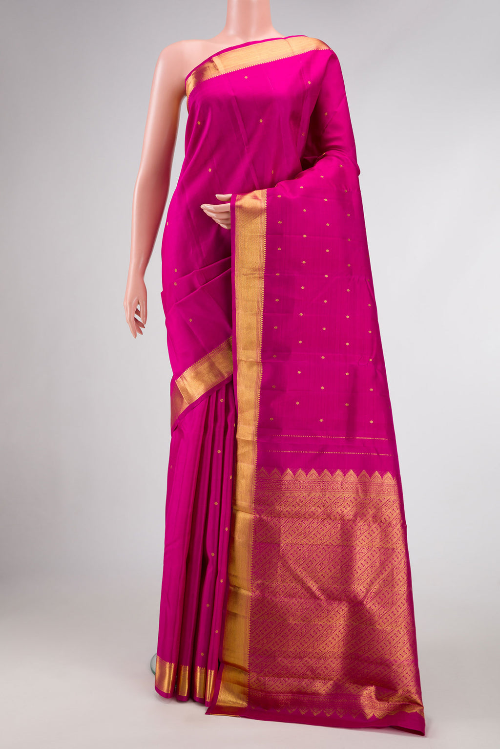 Magenta Dual Tone Kanchipuram Silk Saree with Zari Butta on the body and Zari Border.  displayed on a mannequin