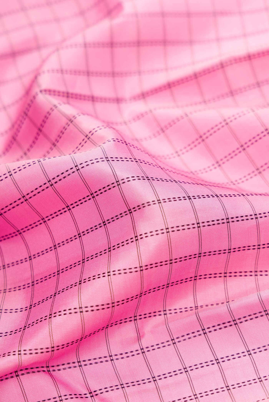 Close up of Pure Silk Pure Zari Pink Dual Tone Kanchipuram Saree with Checked design on the body and Zari Border.  displaying folds