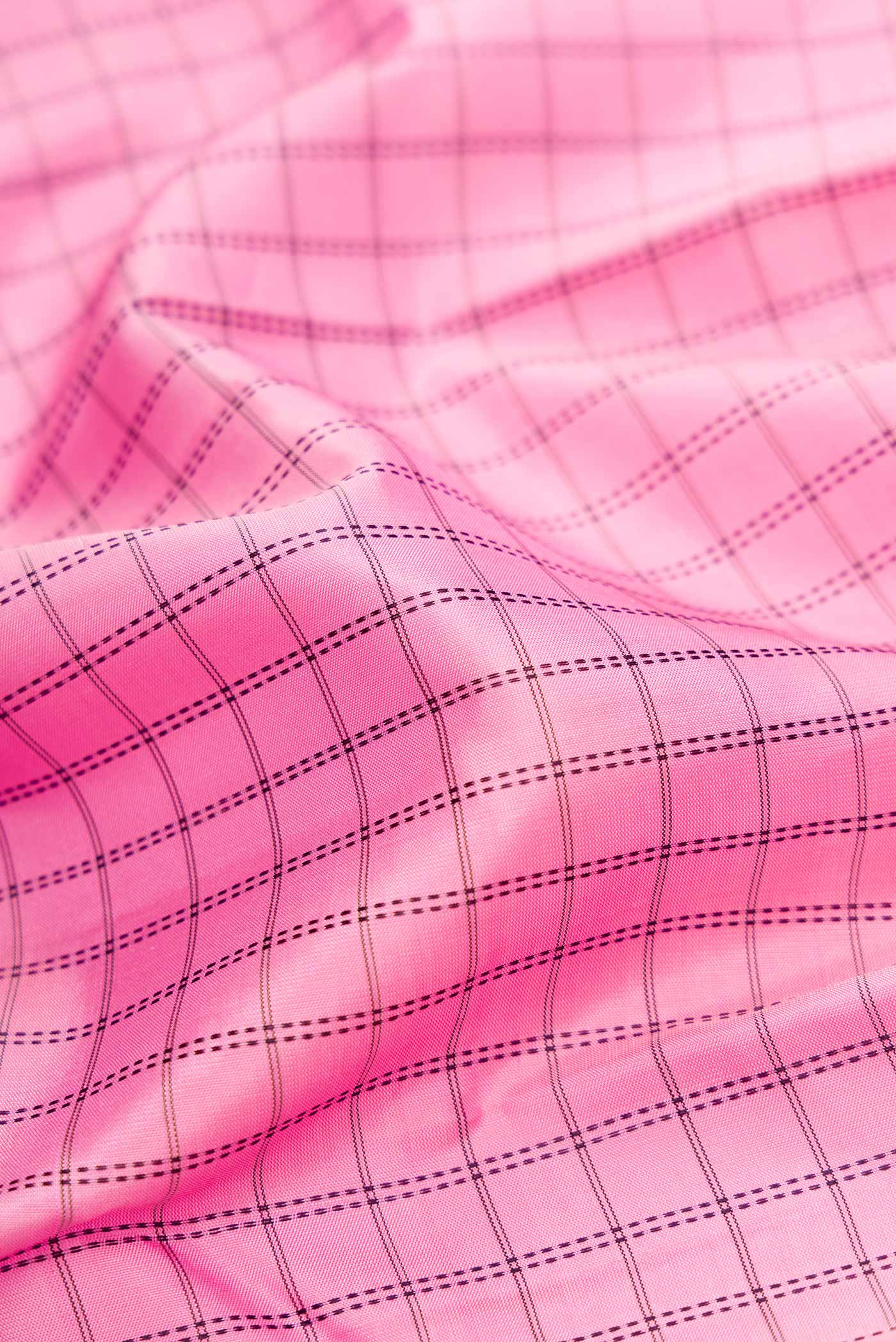 Close up of Pure Silk Pure Zari Pink Dual Tone Kanchipuram Saree with Checked design on the body and Zari Border.  displaying folds