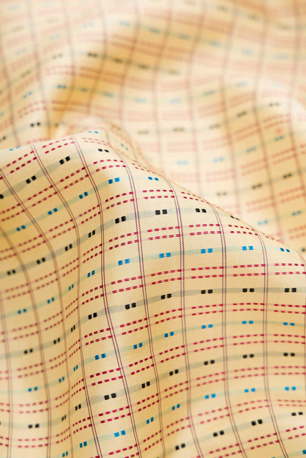 Close up of Sandal Dual Tone Kanchipuram Silk Saree with Checked design on the body and Zari Border.  displaying folds