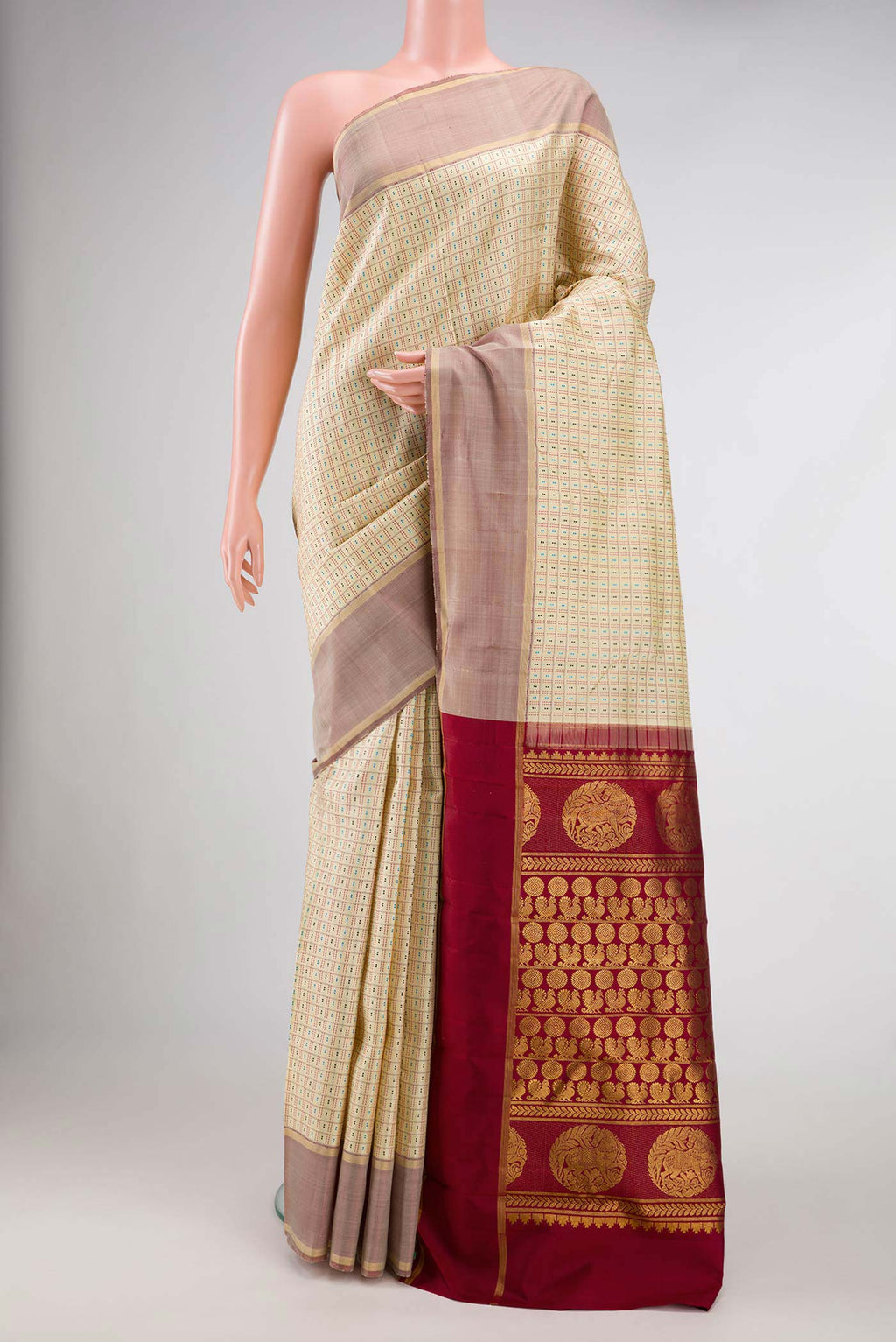 Sandal Dual Tone Kanchipuram Silk Saree with Checked design on the body and Zari Border.  displayed on a mannequin
