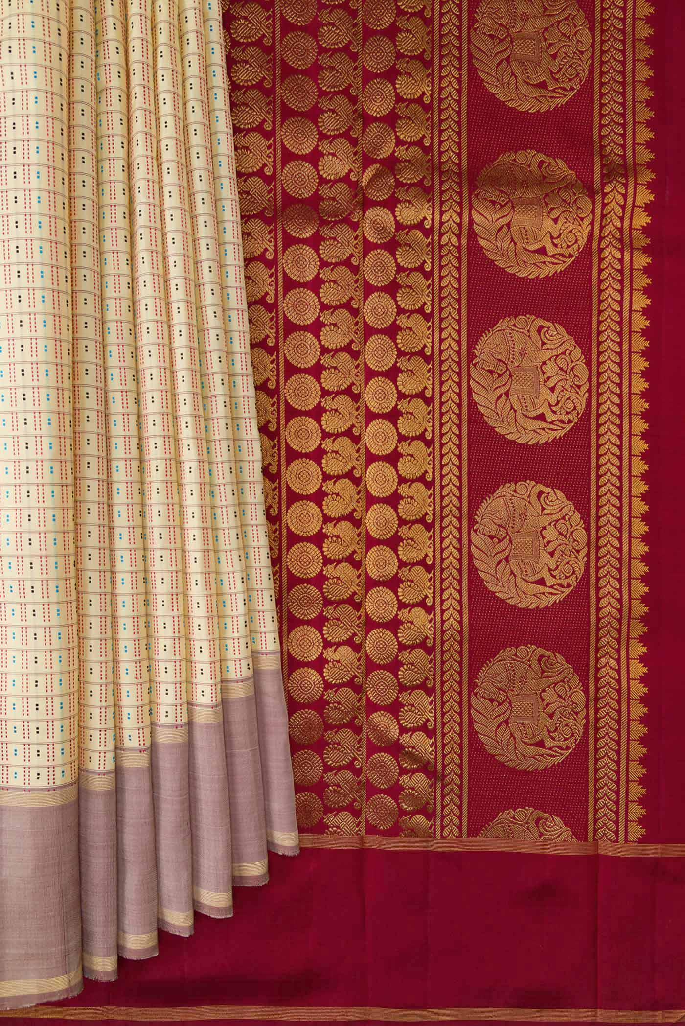 Pleats and pallu of Sandal Dual Tone Kanchipuram Silk Saree with Checked design on the body and Zari Border. 