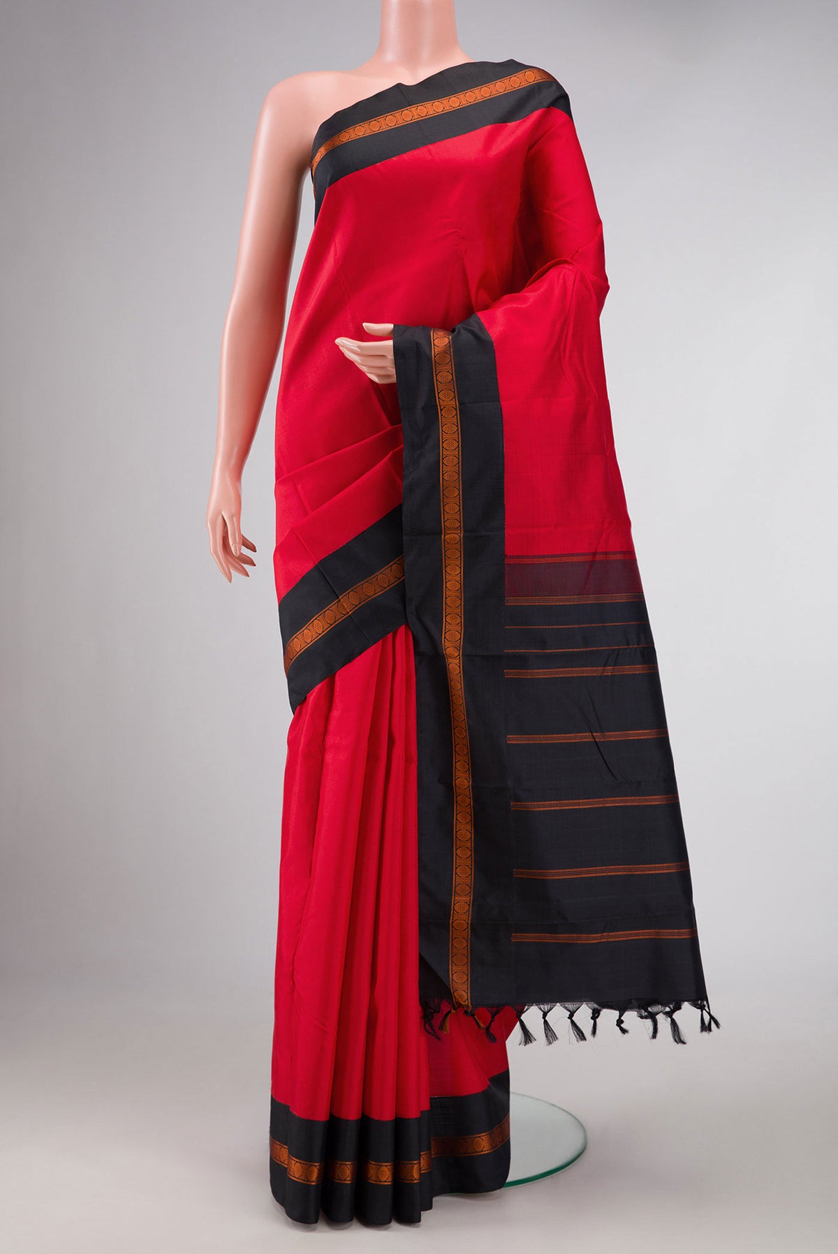 Red Dual Tone Kanchipuram Silk Saree with Plain Body and Thread Border displayed on a mannequin