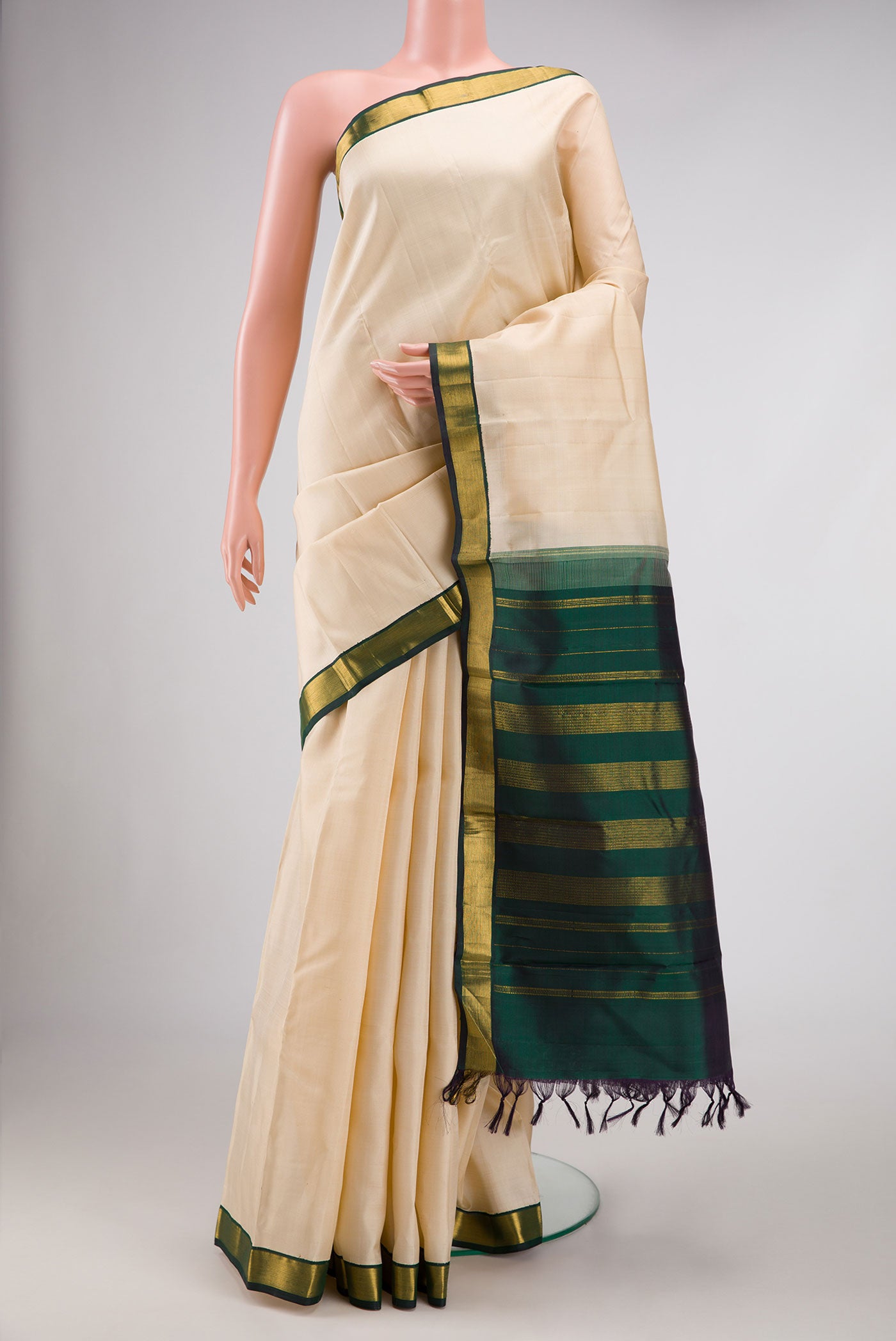 Sandal Dual Tone Kanjivaram Silk Saree with Plain Body and Zari Border.  displayed on a mannequin