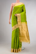 Parrot Green Dual Tone Kanchipuram Silk Saree with Plain Body and Zari Border displayed on a mannequin