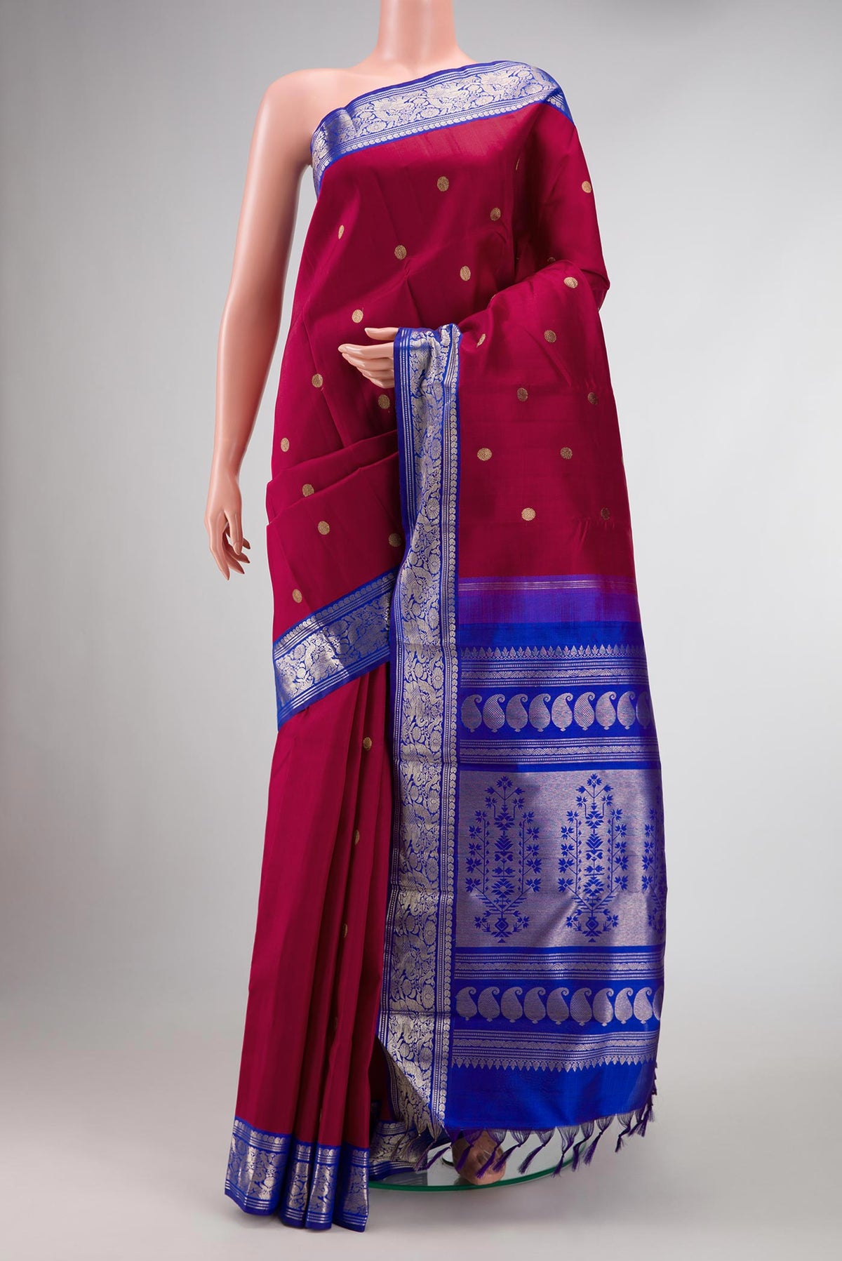 Maroon Dual Tone Kanchipuram Silk Saree with Zari Butta on the body and Zari Border displayed on a mannequin