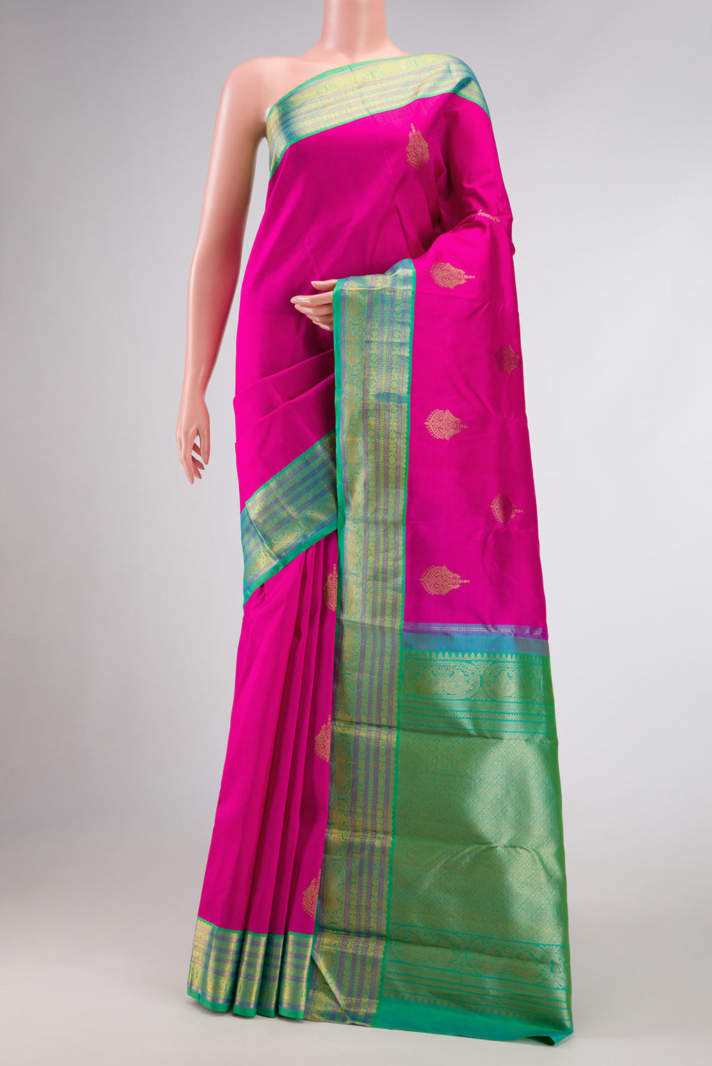 Pink Dual Tone Kanjivaram Silk Saree with Zari Butta on the body and Zari Border.  displayed on a mannequin